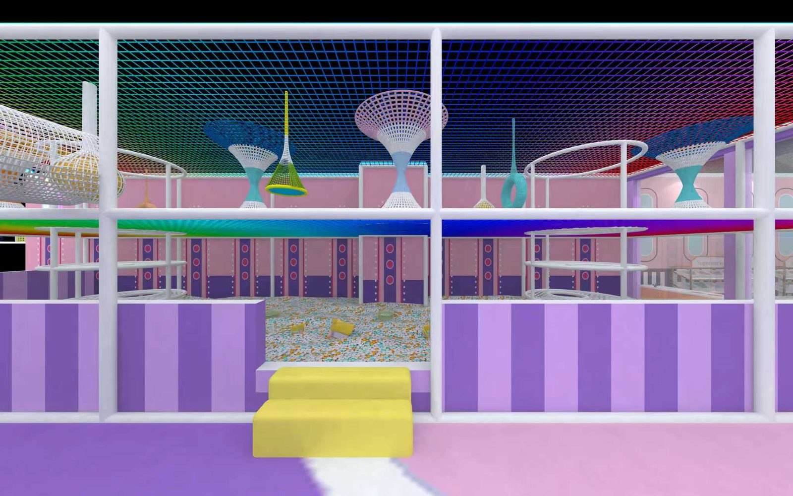 Giant sand play area at Yooland Westgate under a rainbow net ceiling, with climbing towers and sand toys