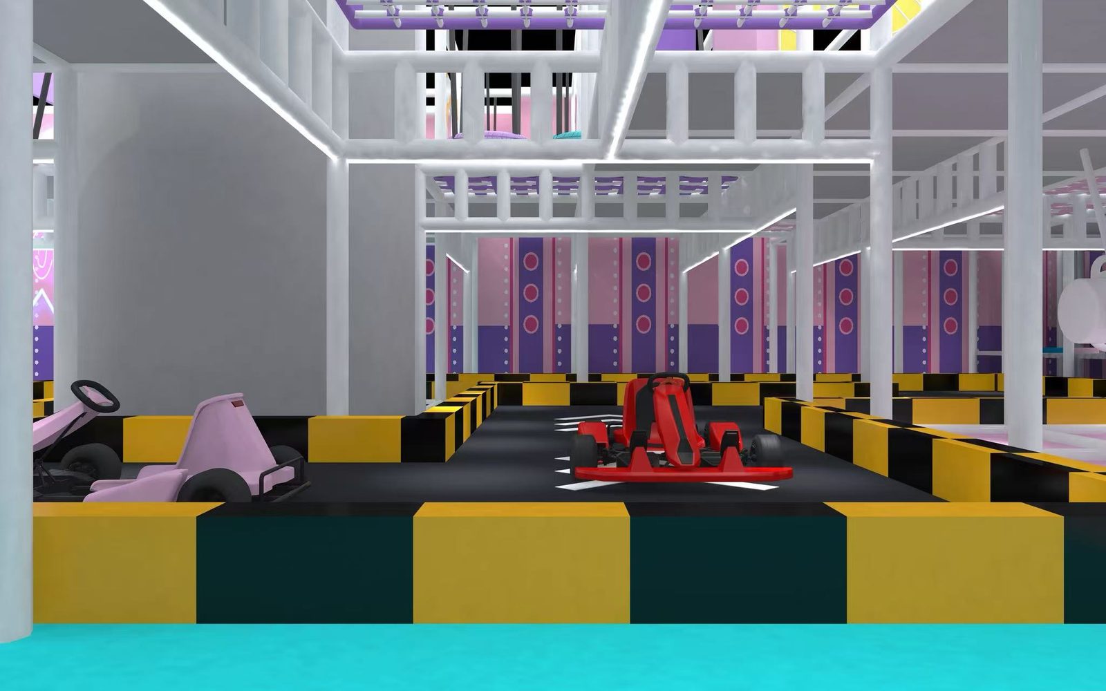 Indoor go-kart track at Yooland Westgate with pink and red mini karts on a black circuit with yellow safety barriers